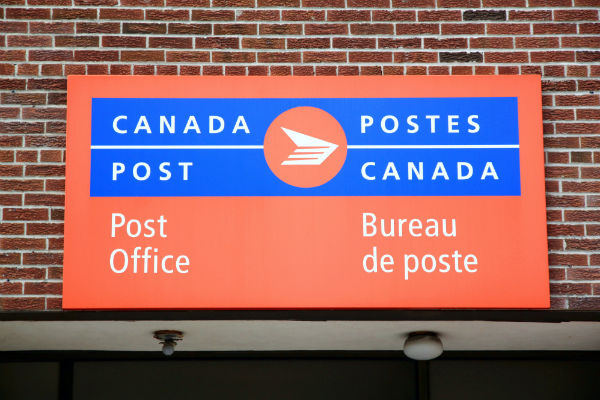 Sign indicating Canada Post within a Northern/NorthMart Store